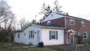 Front corner of the home showing two additions tied together