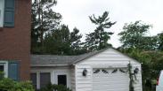 Detail of old breezeway and garage shingles