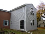 Back of addition sliding glass door and gutter system