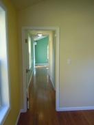 Hallway to additional refinished rooms