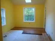 New flooring being installed in bedroom by Drumm Design Remodel