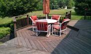 The stain on the deck was wearing off and many boards had become exposed to the elements