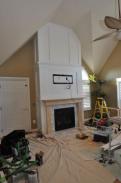 The fireplace trimmed out, wired and the mantel is ready for paint
