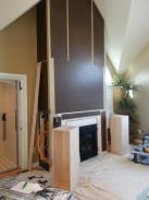The storage cabinet inserts ready to install behind fireplace