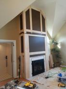 Upper section trim hung on wall preparing for finished trim