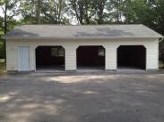 New garage front view by Drumm Design Remodel