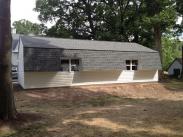 Back of Gambrell roof on garage and back windows