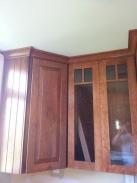Corner kitchen cabinets with glass door fronts