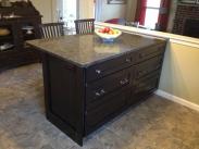 Kitchen peninsula cabinet made to look like a piece of furniture