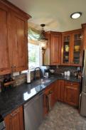 View of new kitchen window, counters, and lighting