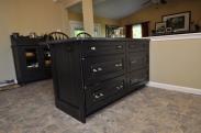 This is a tight shot of the accenting kitchen cabinetry, it's accenting finish makes it look like a piece of furniture 