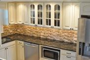 This backsplash highlights the cabinets and countertop, plus the undercabinet lighting really helps the chef see their workspace