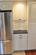 Plenty of storage in this custom kitchen, check out the hidden space for charging cell phones
