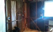 Kitchen demolition included removing the drywall and making sure the walls were plumb again