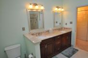 The view from the corner tub of this elegant vanity and mirror set