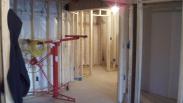 Drumm Design Remodel framing out the storage areas of this basement
