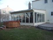 This sunroom in Lansdale, PA was definitely in need of a remodel job. The flat roof, bent gutters and inefficient windows made this sunroom less than a great place to entertain