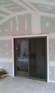 A terrific energy efficient sliding glass door allows quick easy access to the home plus in the Spring, Summer and Fall it will allow lovely breezes into the home without the bugs