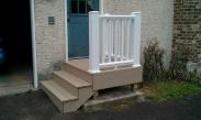 Drumm Design Remodel revitalizes this landing with maintenance free Trex decking and railings