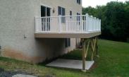 A view of the new deck and concrete pad patio under the deck