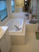 This Montgomeryville, PA bathroom was badly in need of a makeover by Drumm Design Remodel, check out the mirrored wall