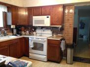 The brown wall and backsplash tile simply had fallen out of style and this kitchen was definitely due for a Drumm Design Remodel