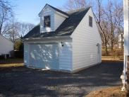 A view of the side attic window and side door, plus lots of spotlights
