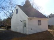 A view from the rear of the garage and the door and rear window for natural light