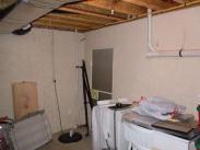 Overhead sprinklers had to be worked around in this basement