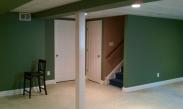 The storage space that was next to the stairs is now hidden behind a stylish six panel door
