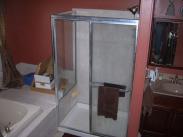 The old shower had a frame and shower base that did not match the homeowners sense of style