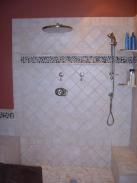 The new tile and rain shower head, very impressive