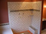 Grouting the tile and ready for the fixtures and shower floor