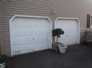 The old wood garage doors were falling apart and ready for replacement