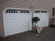 The newly installed Drumm Design Remodel aluminum garage doors with windows look fantastic