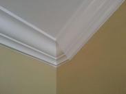 A difficult corner cut in this crown moulding executed masterfully by Drumm Design Remodel