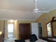 A wide view of the ceiling and hallway crown moulding