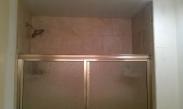 New tile and a better fitting shower door thanks to Drumm Design Remodel