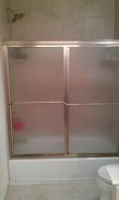 This new shower door actually fits the space and tub properly