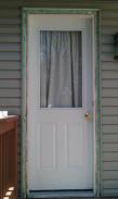 Drumm Design Remodel packed around the door with new insulation to keep this home weather tight