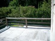 The roofing material and railing were worn and not safe for guests...time for Drumm Design Remodel