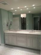 The can lights in the ceiling installed by Drumm Design Remodel provide light strategically and really brighten this space