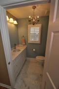 Check out the chandelier in this powder room too...what a great new space