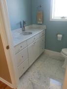 The new vanity and hardware installed by Drumm Design Remodel
