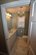 An amazing powder room transformation by Drumm Design Remodel