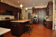 A view of the island, new cabinetry and corner office space in this dream kitchen
