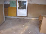The garage slab before Drumm Design Remodel is a disaster waiting to happen