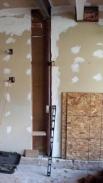 The Drumm Design Remodel Team opening up walls to make this home stable again