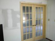 New French doors and repaired drywall courtesy of Drumm Design Remodel