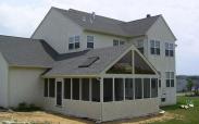 The finished screened porch blends seamlessly into the existing home